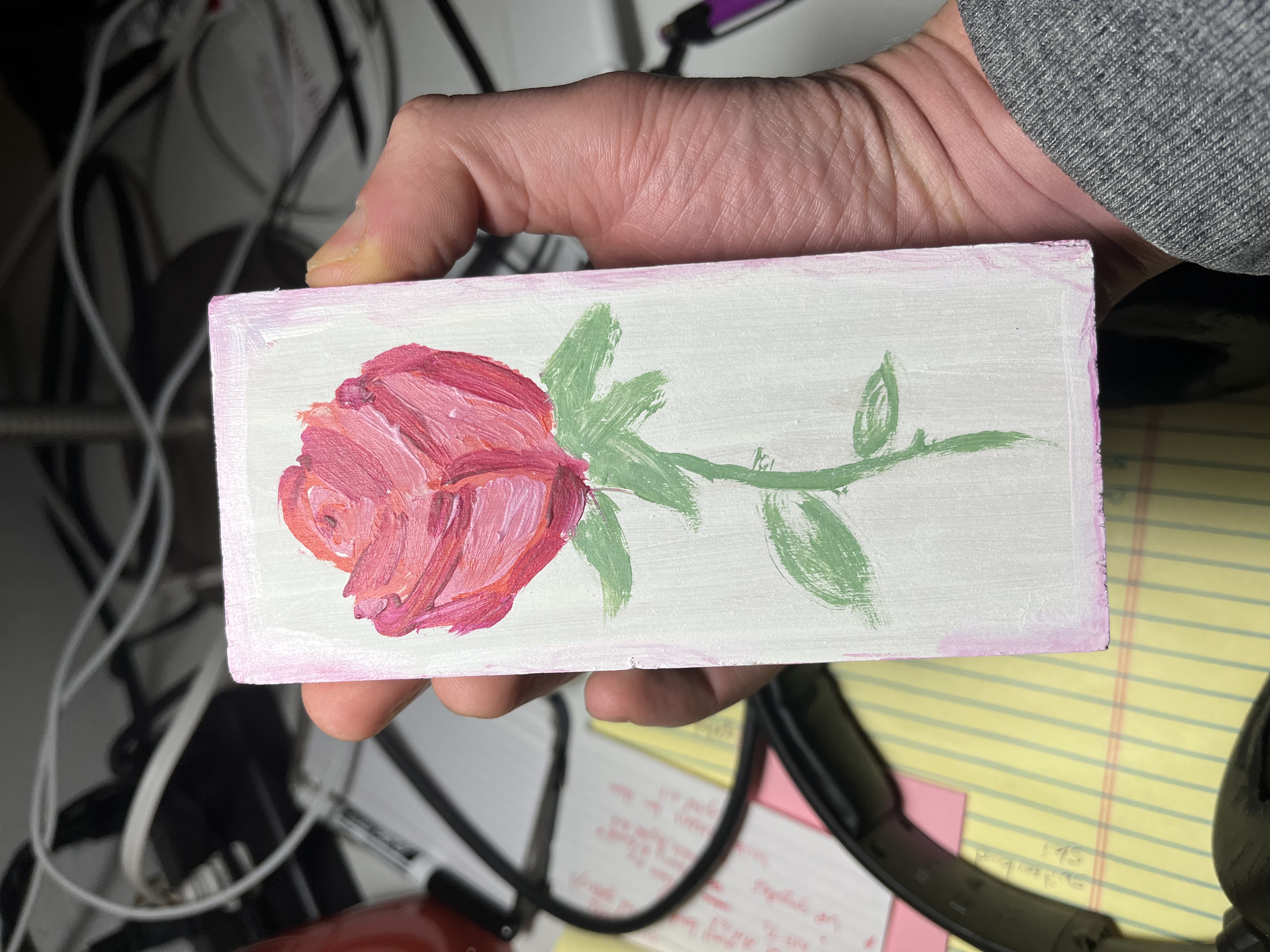 Acrylic painting of a rose on a piece of wood