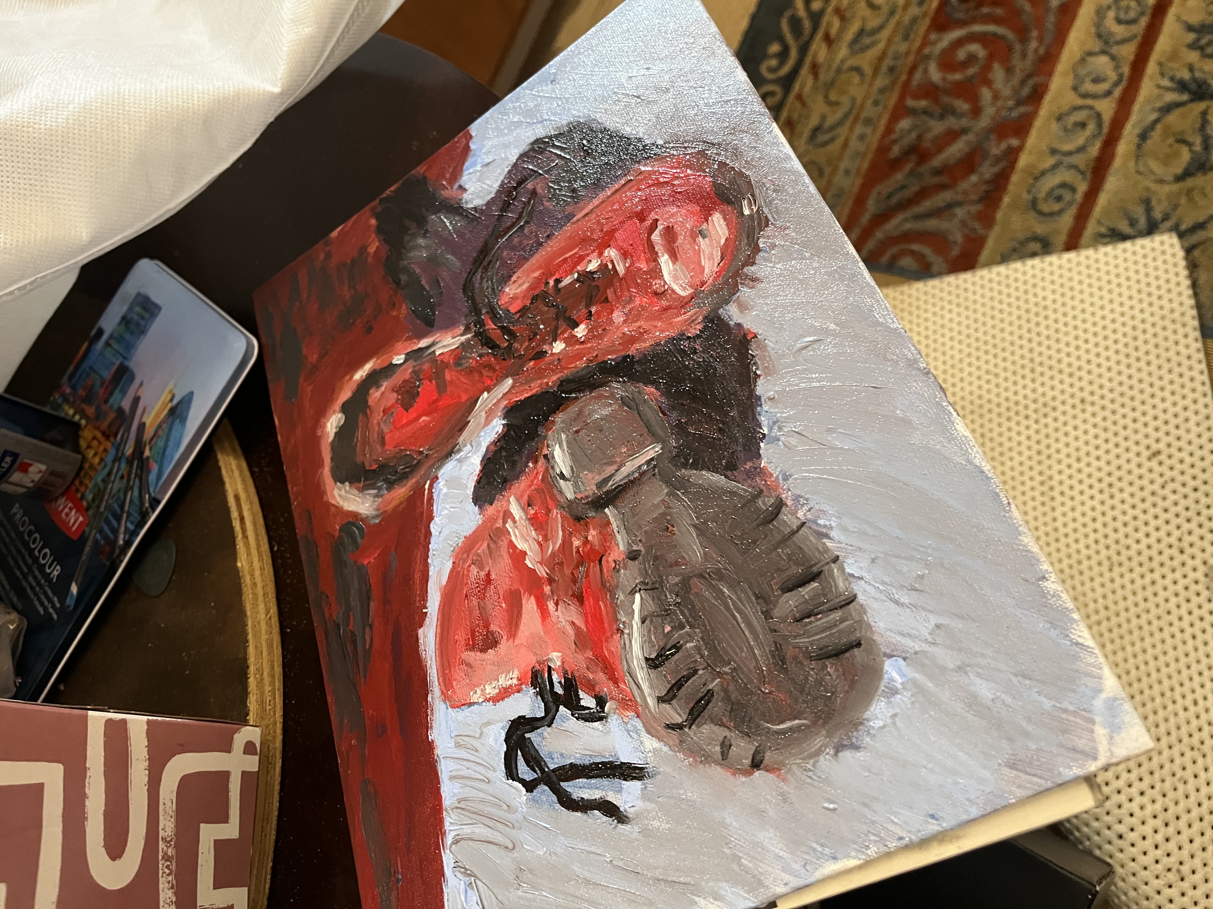 Oil painting of two red boots